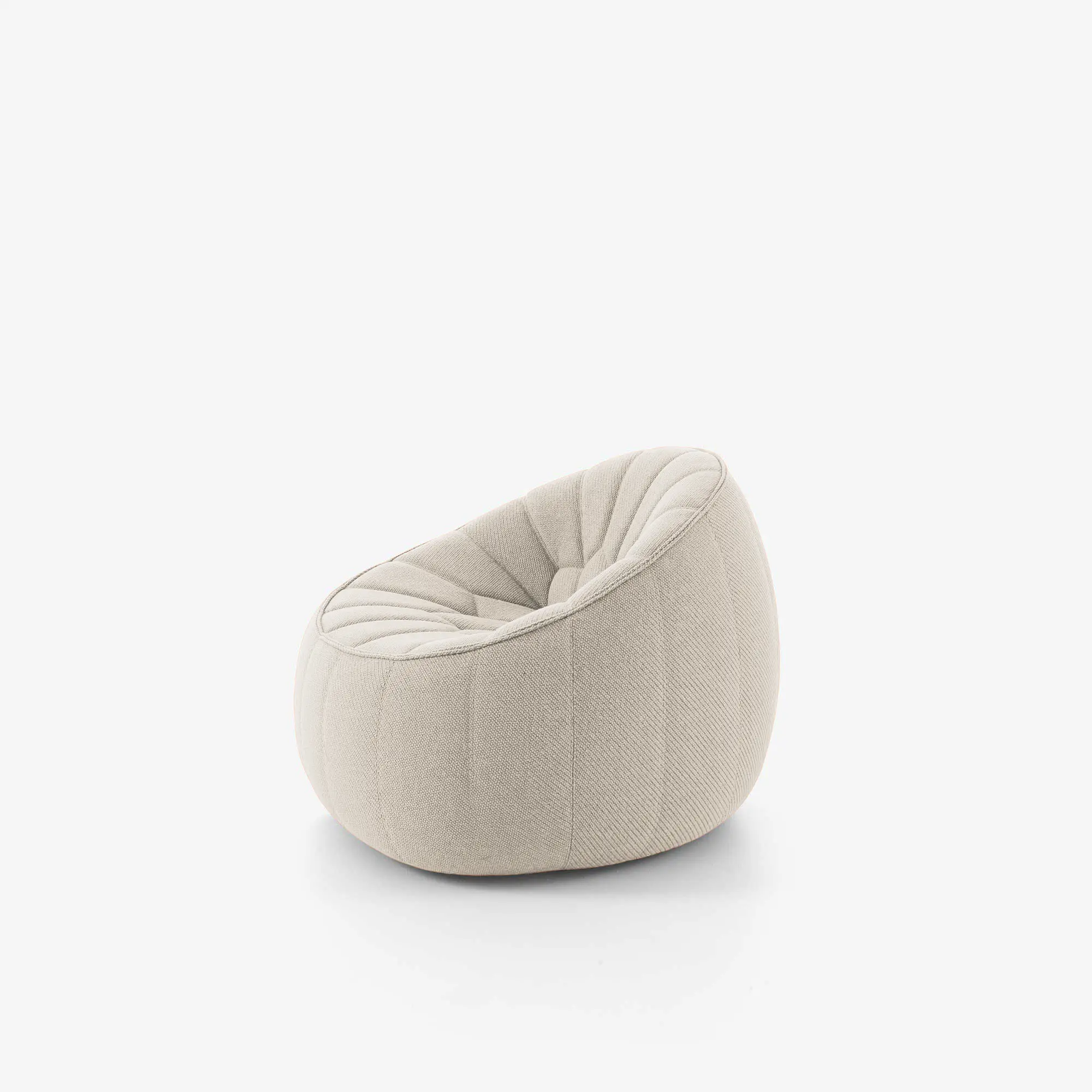 Beige rounded swivel armchair with plush, segmented upholstery on a white background.