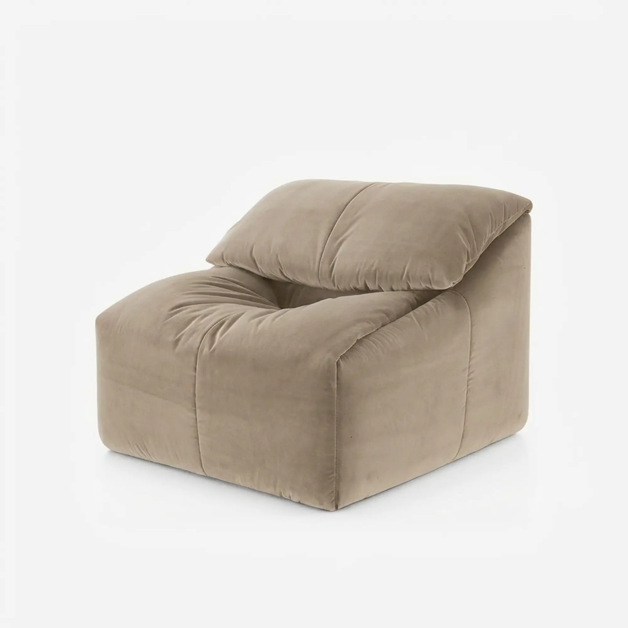 Beige modern plush armchair with a tufted cushion and a low backrest.
