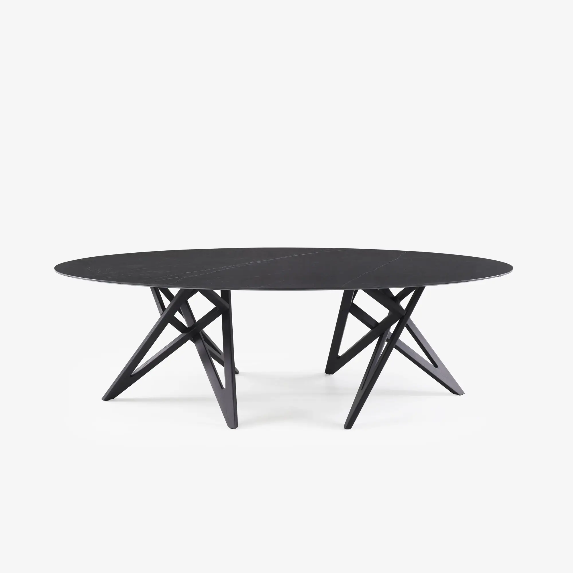 Oval black table with a sleek top and unique geometric angled legs.