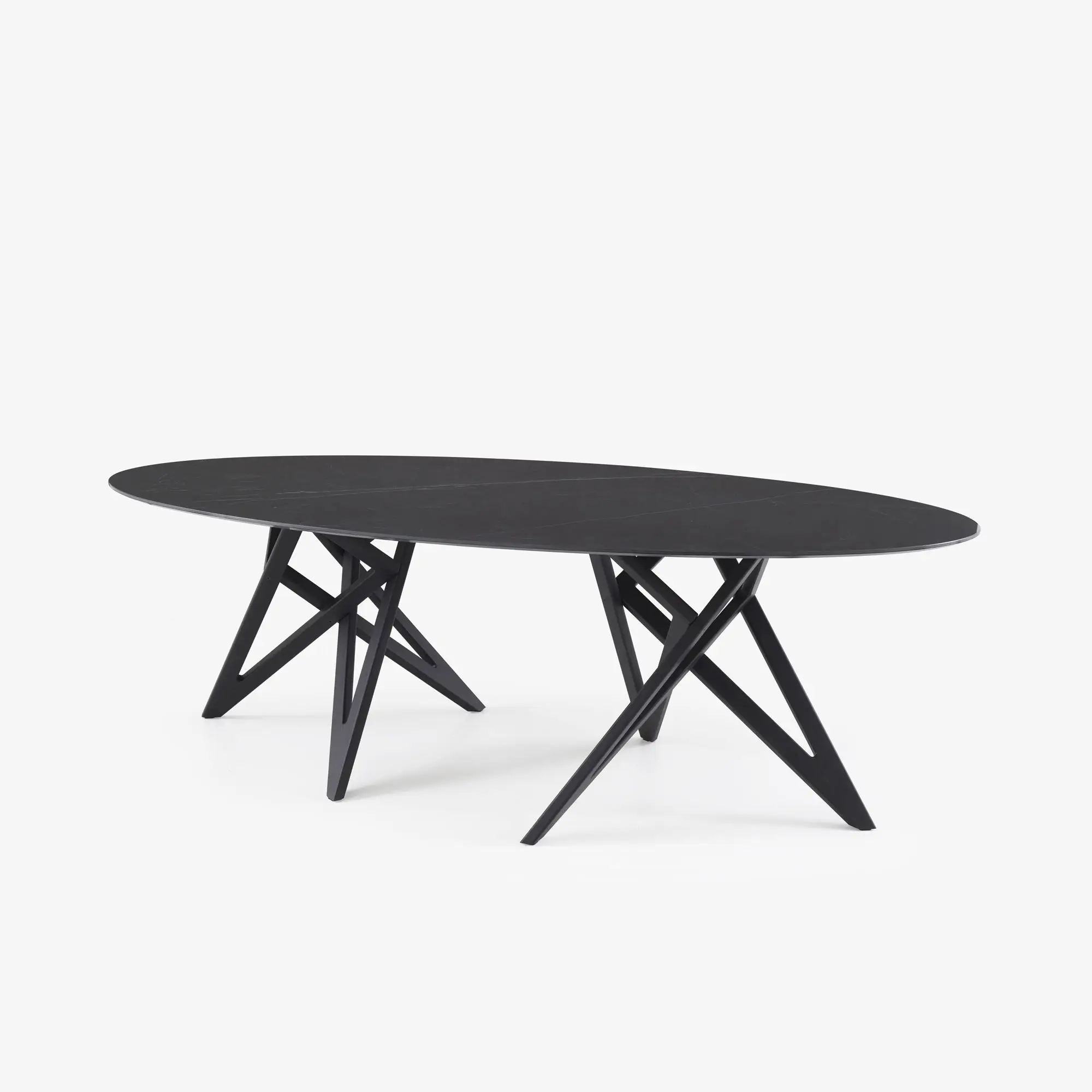 Modern black oval dining table with angled, crisscrossed legs.